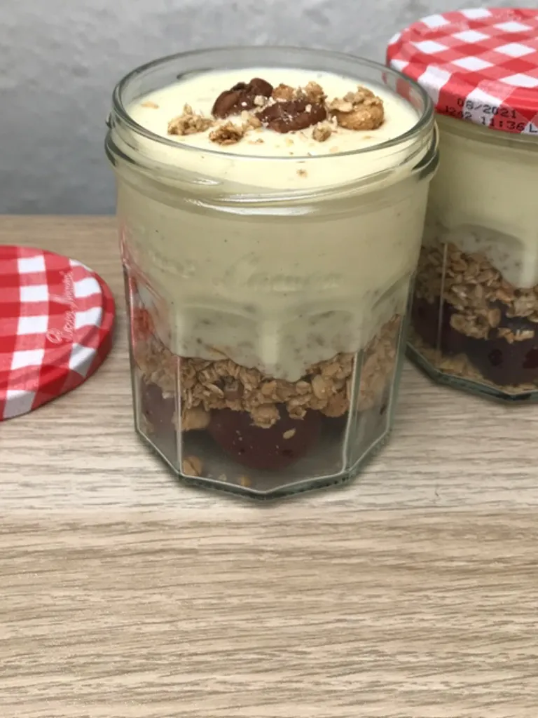 Breakfast pot with cherry, oats and vanilla yoghurt