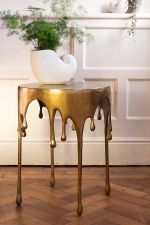 Quirky gold drip bedside table