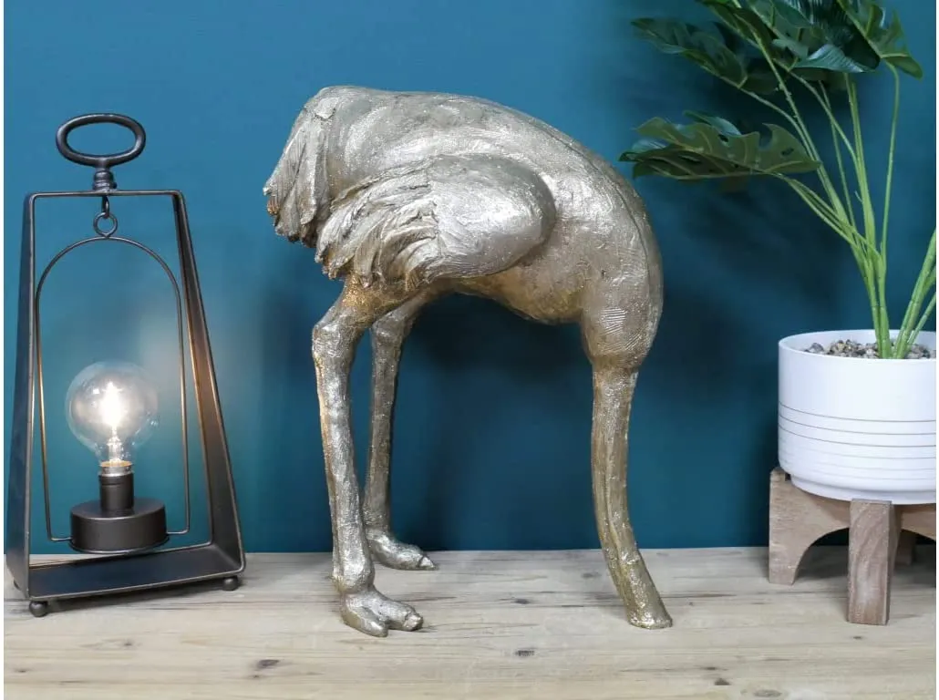 Quirky Homewares ostrich sculpture with its head in the sand