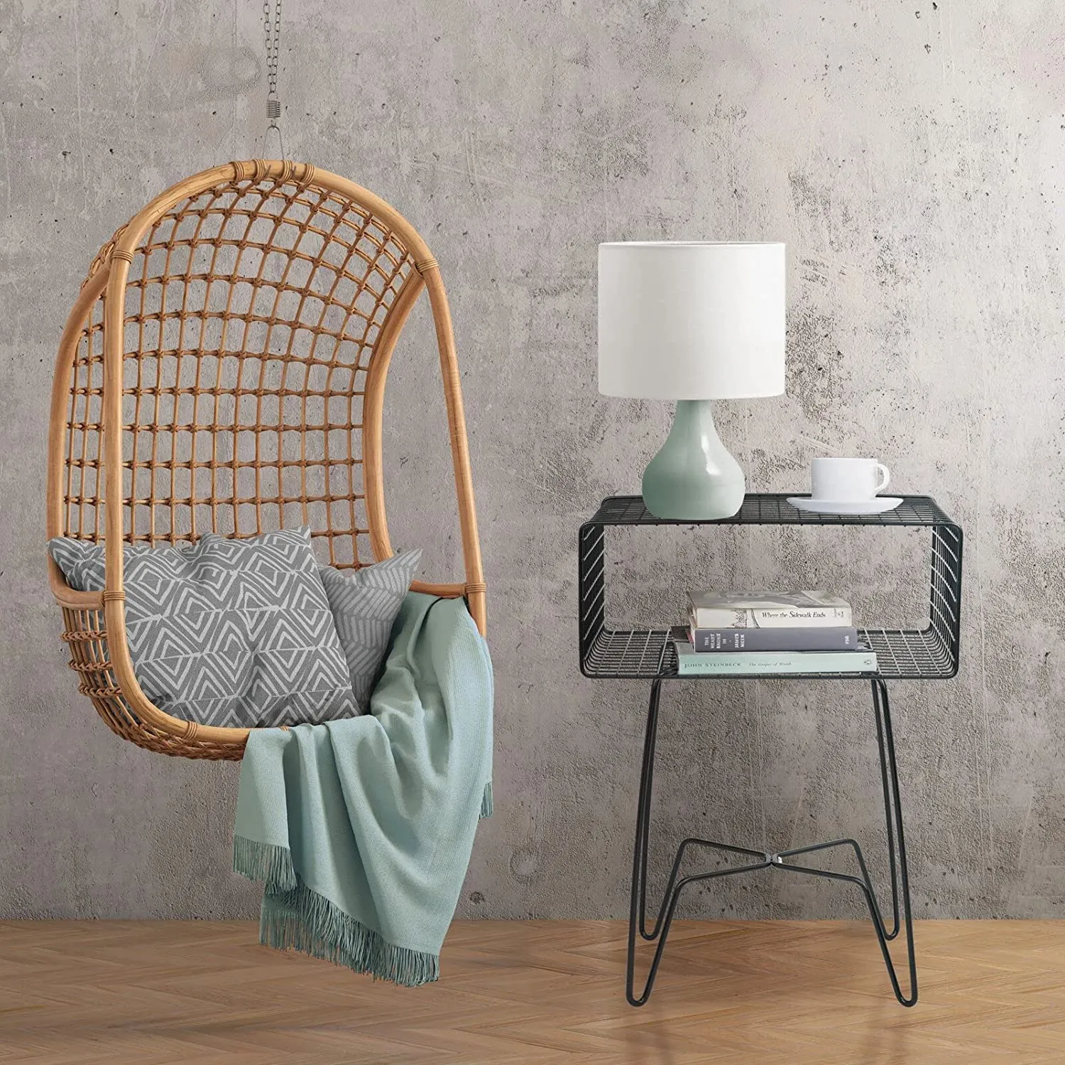 Black wire bedside table with a quirky design