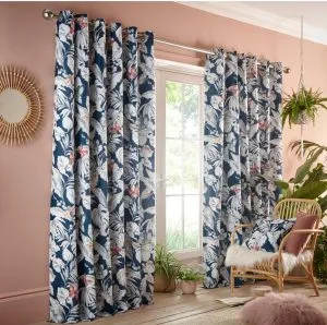 Blue floral curtains against pink walls