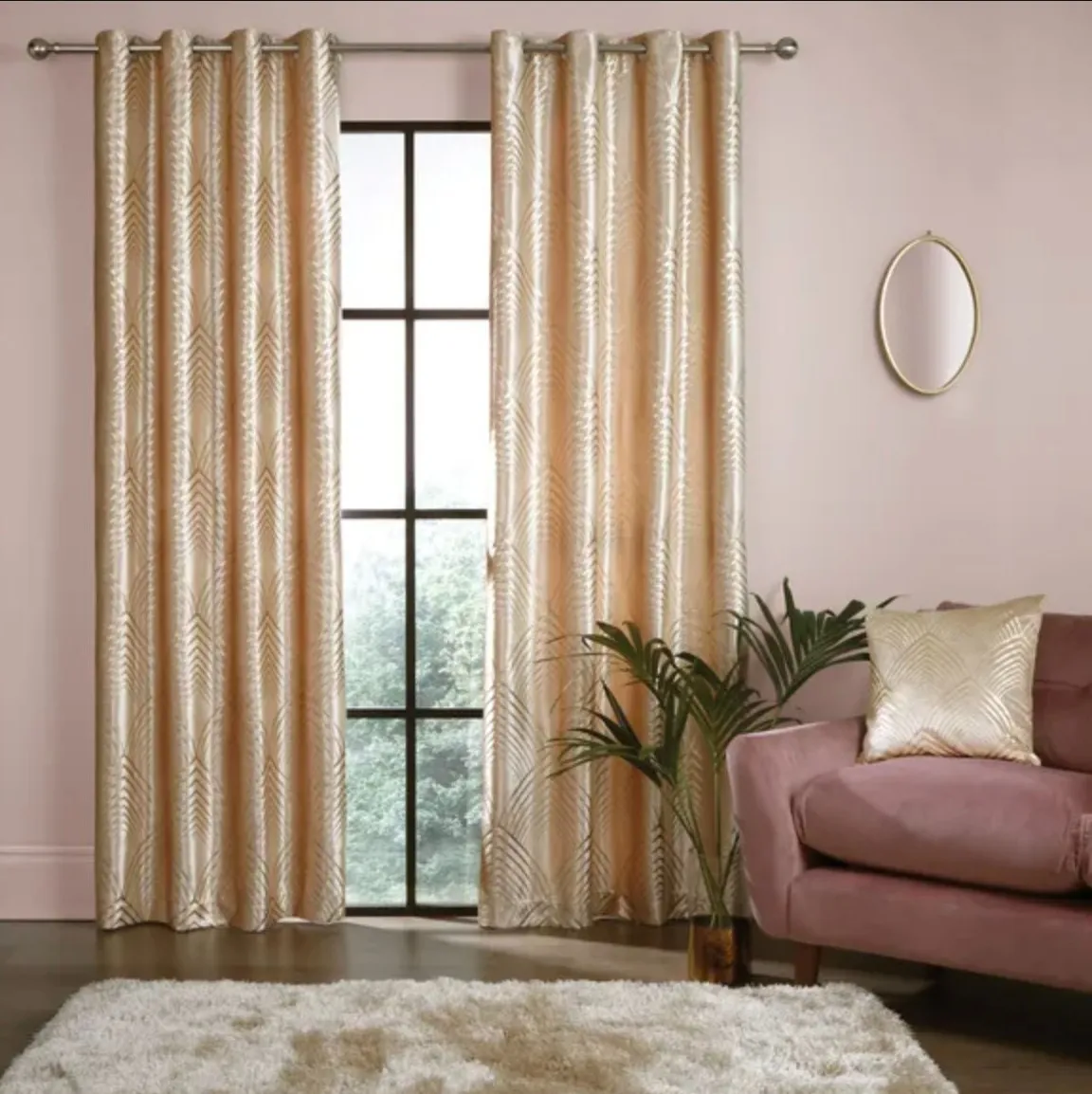 Gold curtains in a room with pink walls
