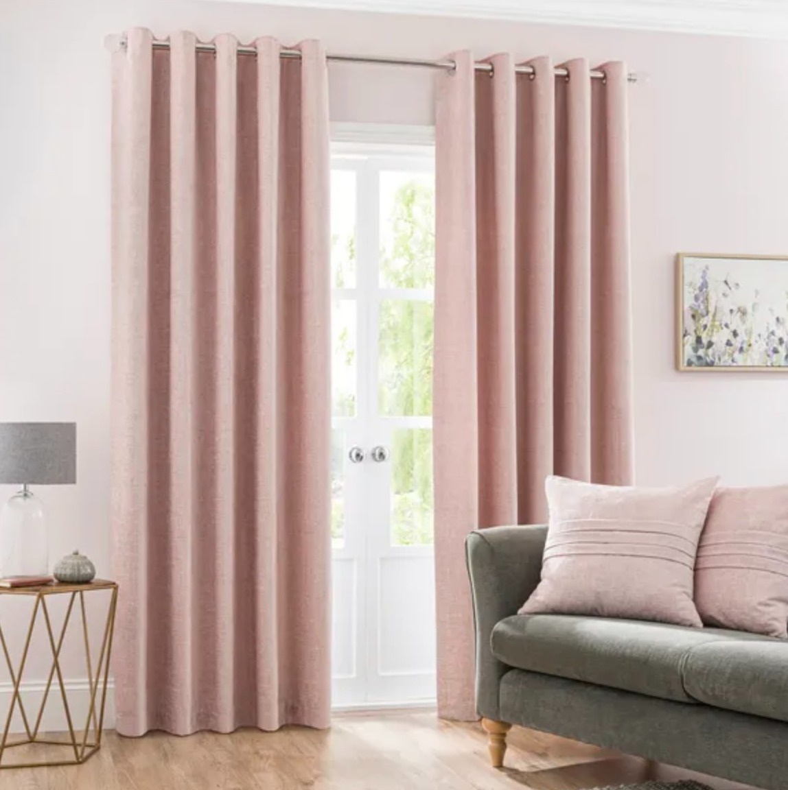 Pale pink curtains against a light pink wall