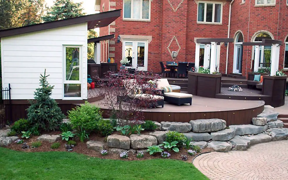 Image of decking in backyard with a house with new white windows