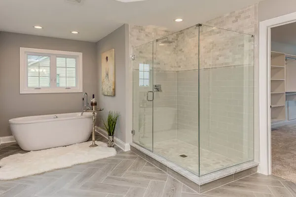 luxury grey bathroom with herringbone polyglot flooring