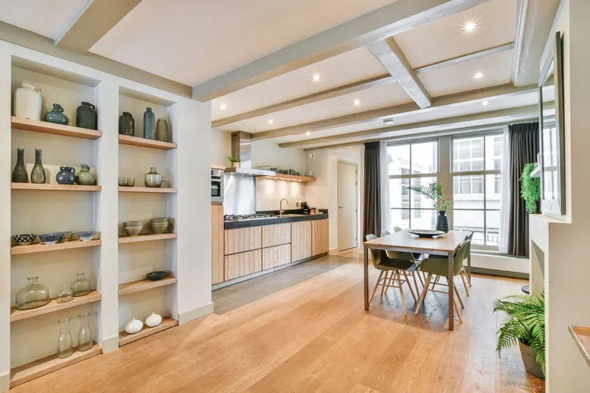 A large kitchen room with a dining table and Polyflor flooring