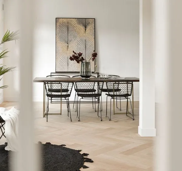 Modern dining room with luxury herringbone flooring by Quickstep