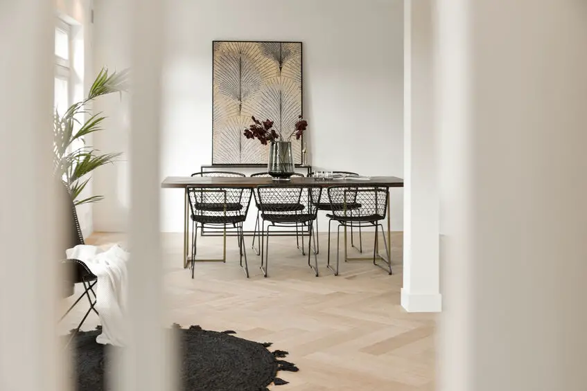 Modern dining room with luxury herringbone flooring by Quickstep