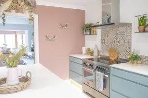 Pink and blue kitchen. Painted in sulking room pink