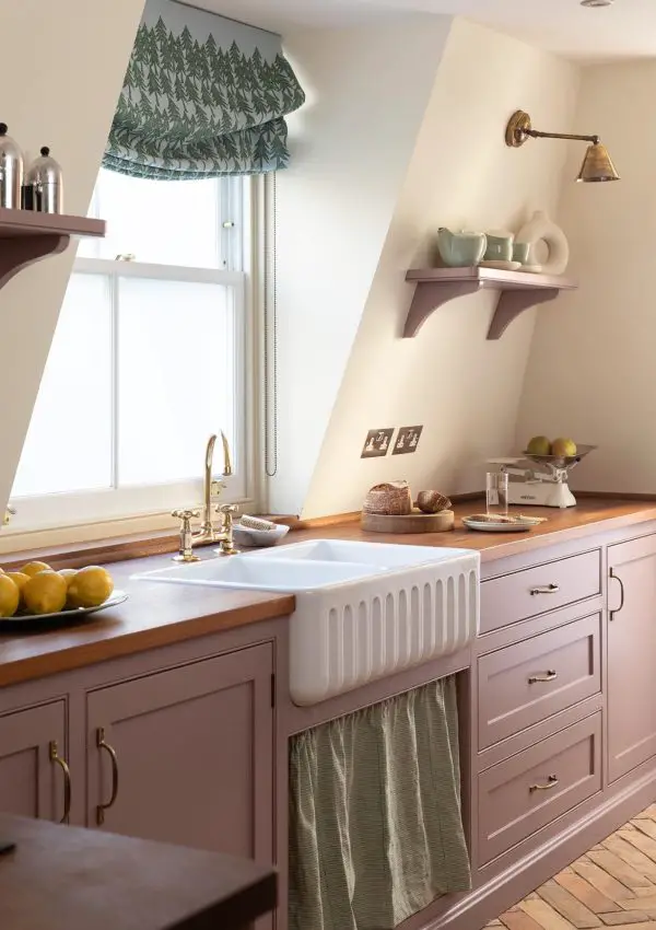 Traditional kitchen with cabinets painted in sulking room pink and walls in new white by farrow and ball