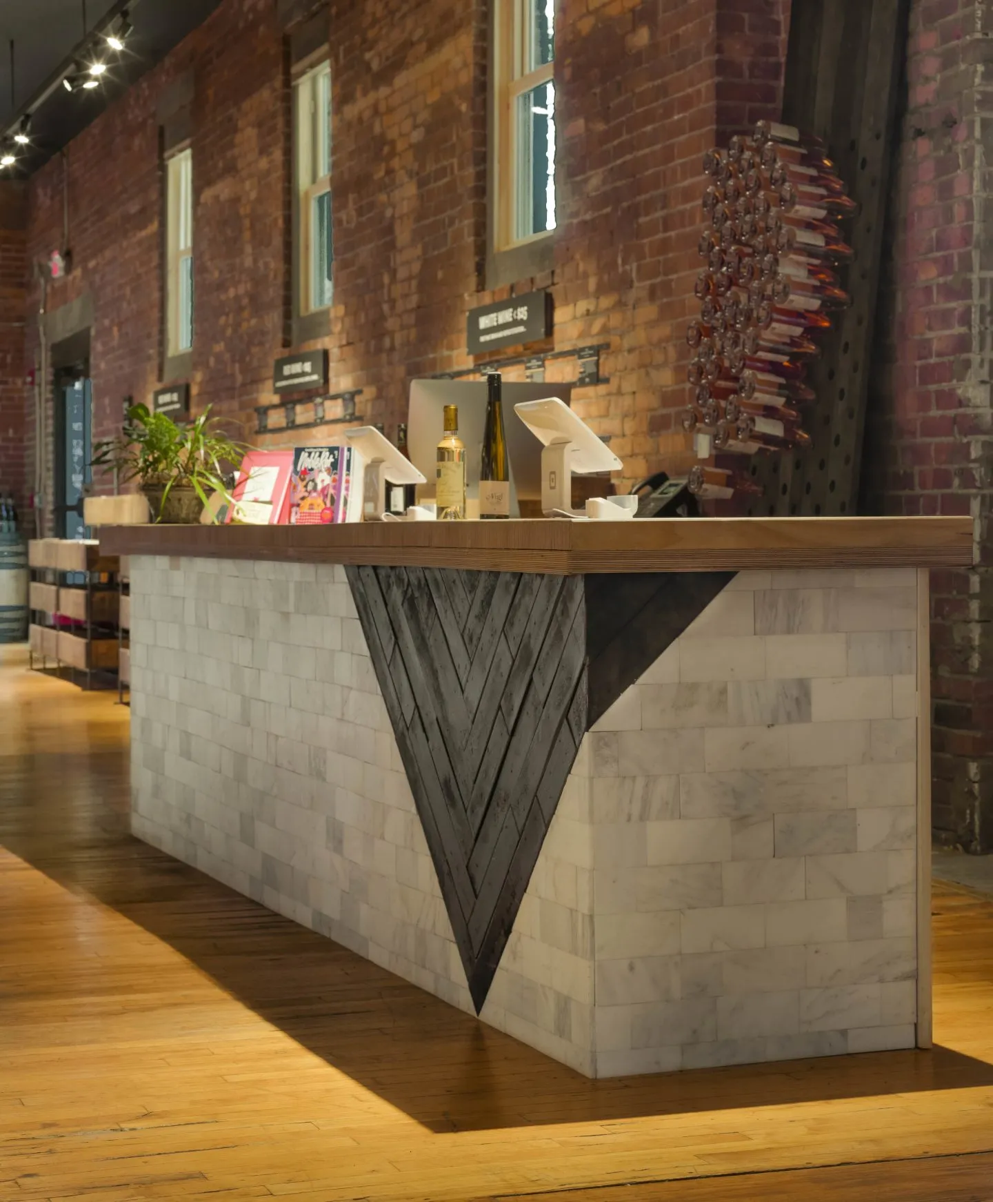 Industrial wine shop counter design with a touch of luxury.