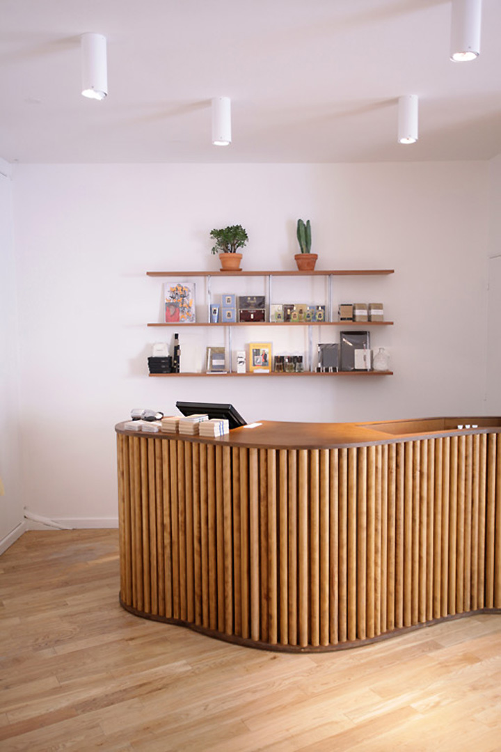 Rustic shop counter design featuring a curved wooden counter.