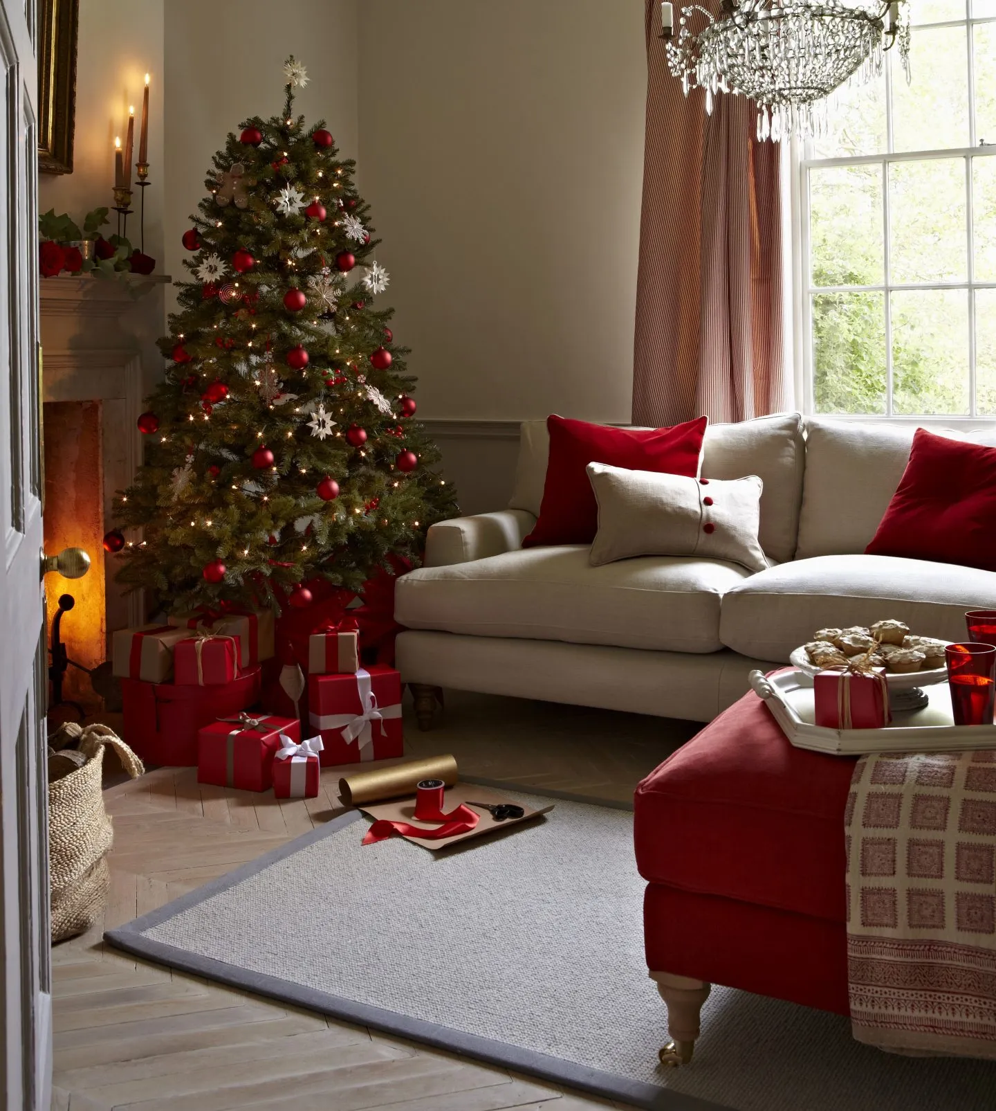 Cosy living room with a red and gold Christmas tree